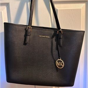 Michael Joe’s black shoulder bag
